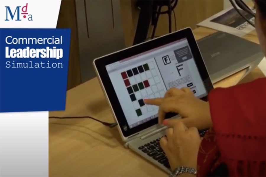 A female business leader taking part in a commercial leadership simulation